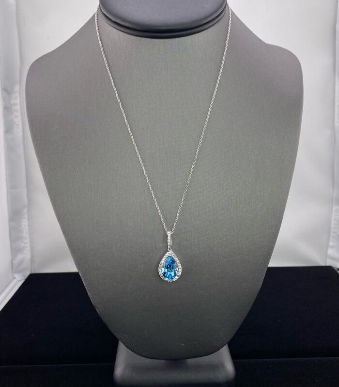 Sterling Silver Aquamarine Teardrop with White Crystal Halo Pendant.